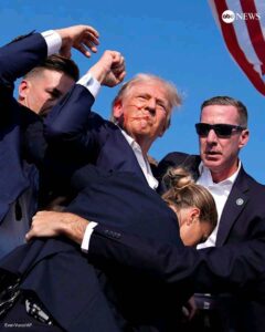 Former President Donald Trump was swarmed by Secret Service agents and rushed off stage as possible shots were heard during a rally in Butler, Pennsylvania, on Saturday.