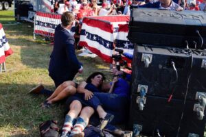 Former President Donald Trump was swarmed by Secret Service agents and rushed off stage as possible shots were heard during a rally in Butler, Pennsylvania, on Saturday.