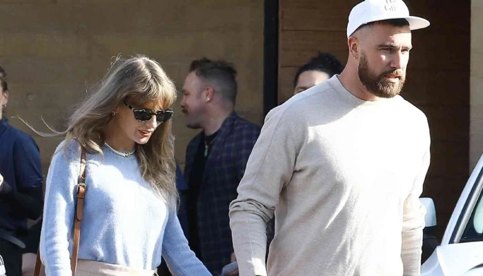 Travis confident in reciprocating Taylor Swift's love publicly while clutching her hand.