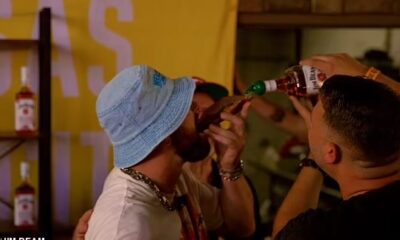Travis Kelce downs a whiskey shot from a slice of BREAD and sings on stage with Patrick Mahomes as he lets loose at his music festival after leaving girlfriend Taylor Swift in Europe
