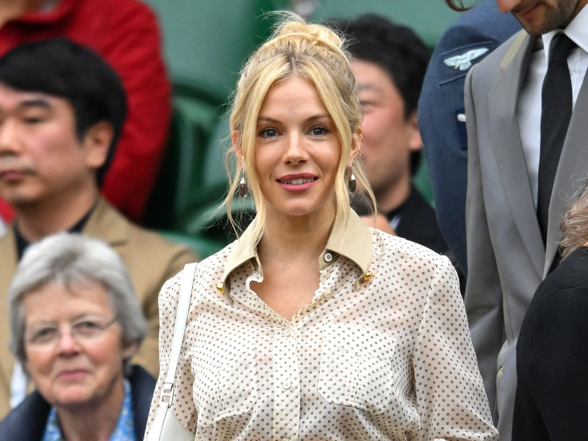 Sienna Miller serves Wimbledon elegance in Prada crop top and skirt set