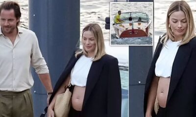 The Barbie star Margot Robbie and husband Tom Ackerley are expecting their first baby as she can be seen proudly displaying her small, but visible baby bump in a white crop top while boarding a boat during a holiday to Lake Como with her spouse.